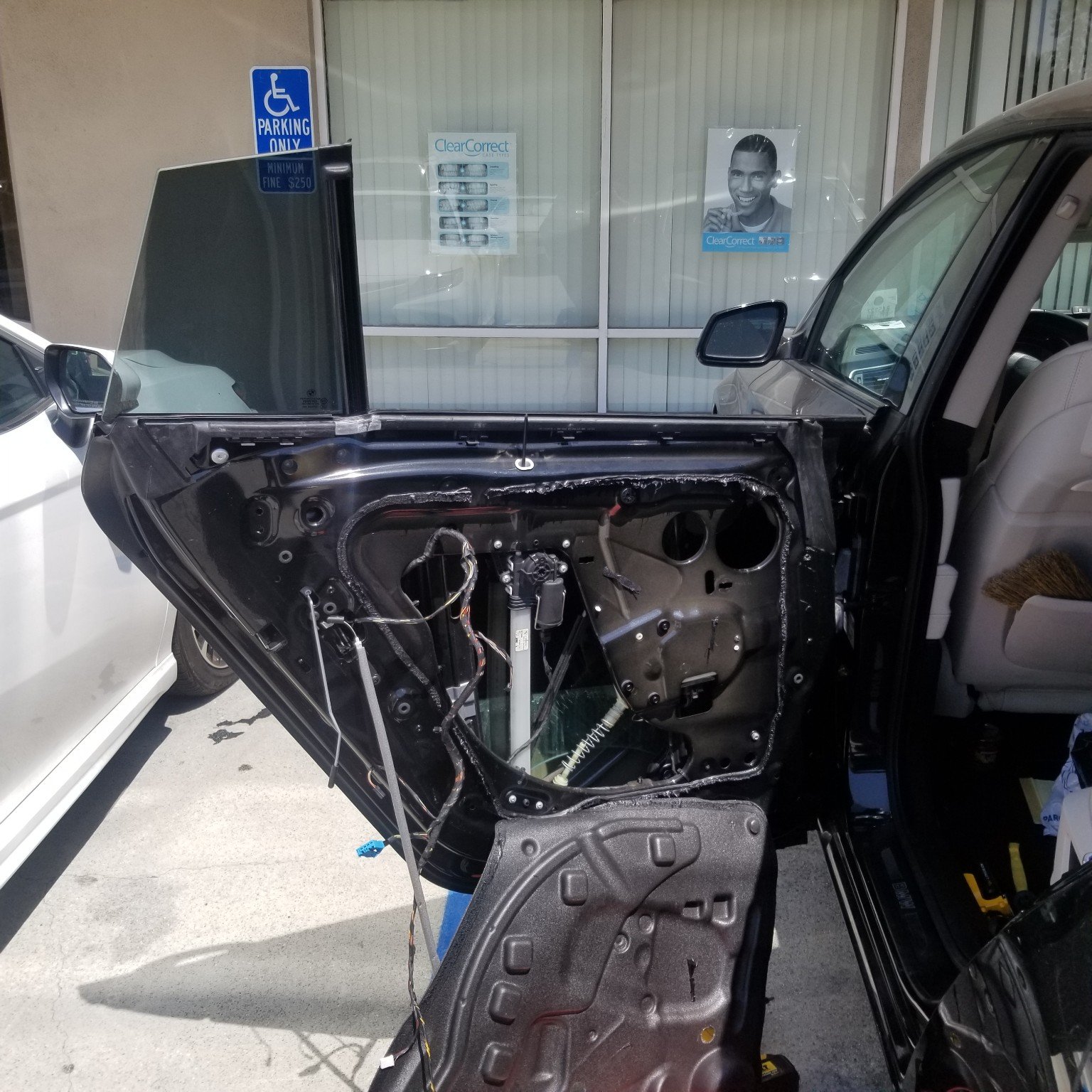 Vehicle door panel area accessed for power window repair