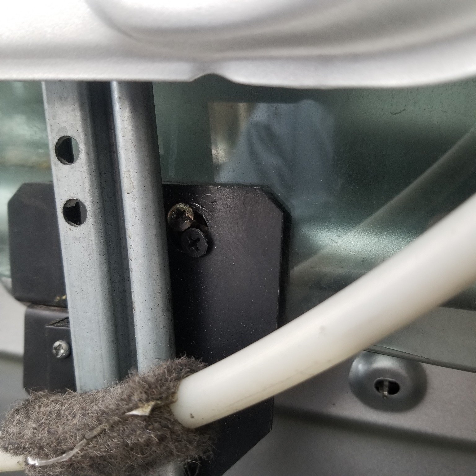 Automotive door window track and regulator hardware